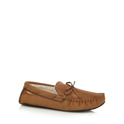 Tan moccasin slippers in a gift box